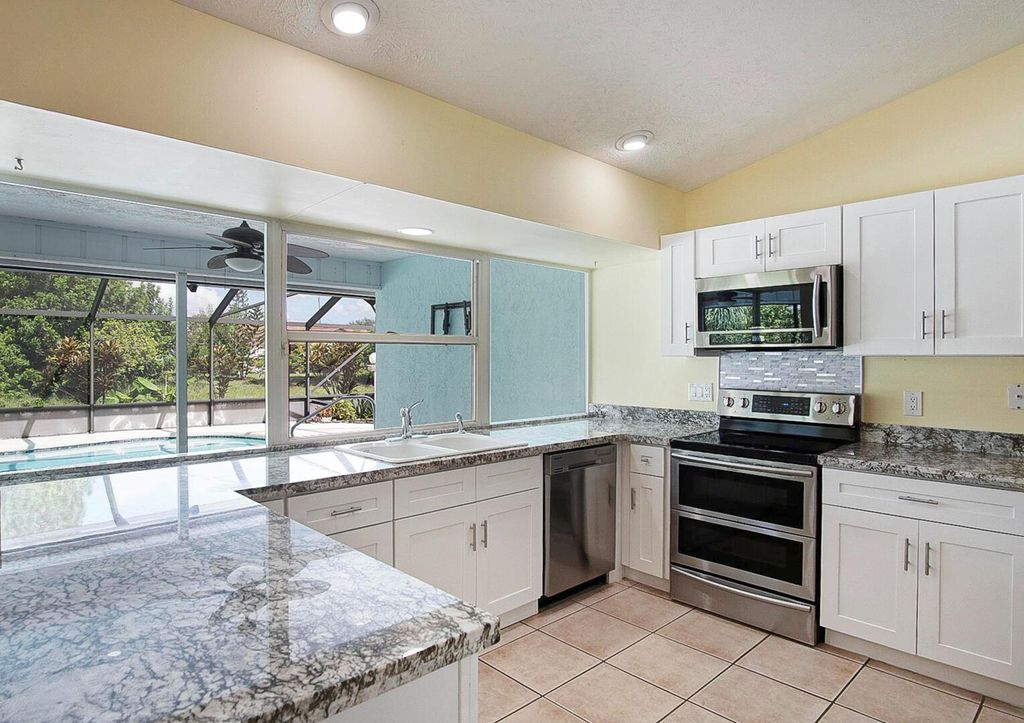 Photo of 560 SE Nome Drive, Port Saint Lucie, FL 34984 (MLS # R11117116)