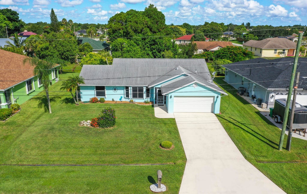 Photo of 560 SE Nome Drive, Port Saint Lucie, FL 34984 (MLS # R11117116)