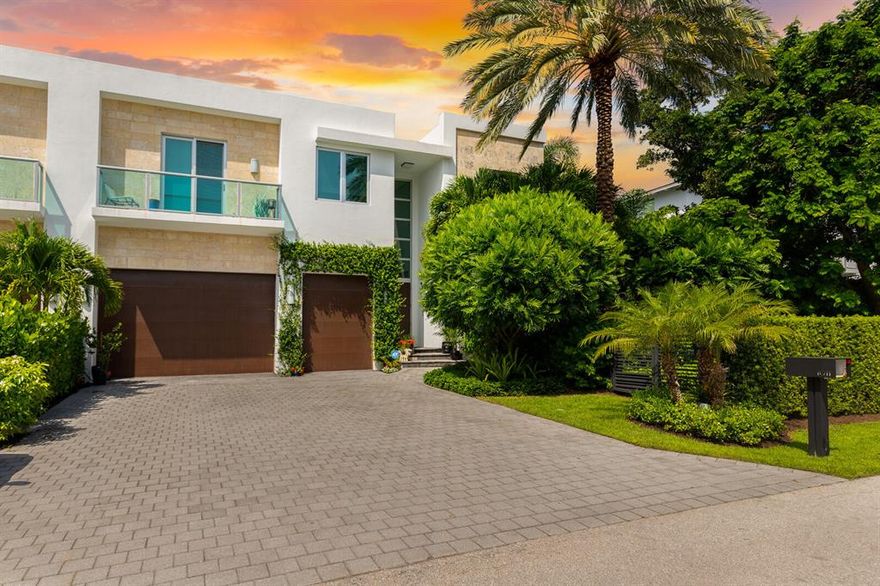 Yes, you can have it all. Location, modern architectural masterpiece, square footage, 5 bedrooms, 5 bathrooms with a tropical serene backyard paradise. 
This boutique, one of two, townhomes lives like a single-family home located in the highly sought-after Seagate neighborhood - Walkability score 100! Located just two blocks from the beach, one block to the Intracoastal, & a short walk to restaurants, night life, and art galleries on  Atlantic Avenue, ''The Ave'' all while being on a beautiful, quiet street. You will find soaring ceilings throughout this modern home, floor to ceiling impact windows & doors, reinforced concrete frame & roof, and a whole house, natural gas generator. The chef's kitchen features  Miele appliances, custom Italian Casa Mia cabinetry, & custom lighting. The massive primary suite features a sitting area overlooking a beautiful garden oasis, including His and Her custom walk-in closets and primary bath with large soaking tub as well as separate His and Her wash stations.  Additional Features Include:

*Lutron motor shades and custom window treatments
*Porcelanosa wood-like tile 
*Custom walk-in closets throughout
*New gas burning fireplace
*Interior and Exterior camera system
*Smart Home Controls
*Tropical landscaping, including a large grassed yard
*Stunning Alex Turco patio wall mural
*Recently refinished heated pool and jacuzzi
*New patio pavers and landscape lighting
*Elevator
*Custom Sound and Camera System