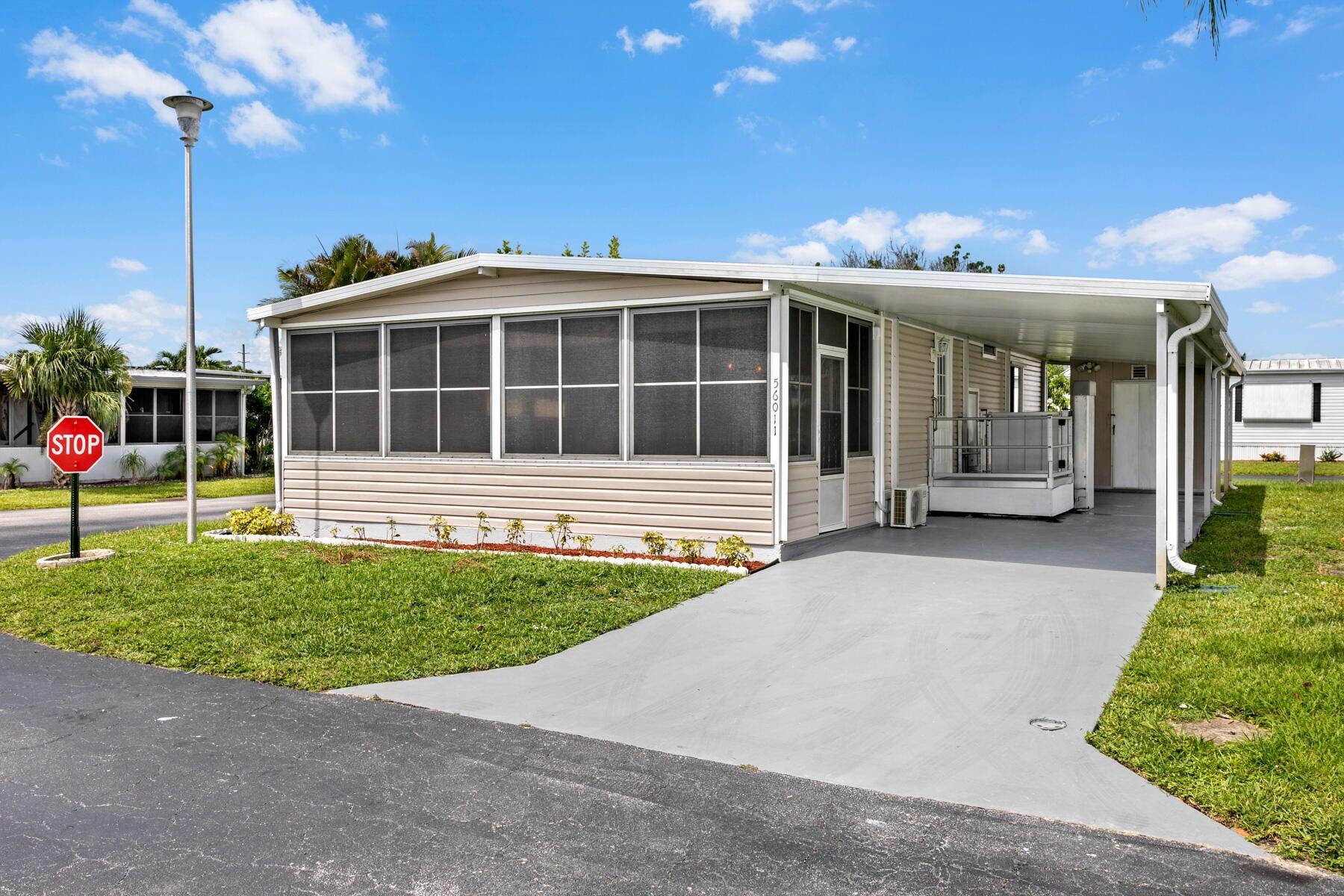 Motivated Seller! Welcome to this beautifully remodeled 2-bedroom, 2-bathroom home located in a gated 55+ community. This move-in-ready residence features a brand-new kitchen complete with white shaker cabinets, quartz countertops, ample pantry storage, new stainless steel appliances, and stylish pendant lighting. Enjoy new vinyl flooring and fresh paint throughout, giving the entire home a clean and modern feel. Both bedrooms offer spacious walk-in closets, and the bathrooms have been completely updated with new tile, vanities, toilets, and walk-in showers. Relax in the bright Florida Room, featuring new tile flooring, a split mini A/C system, and an eastern exposure for those refreshing morning breezes. The home is equipped with hurricane protection on windows
