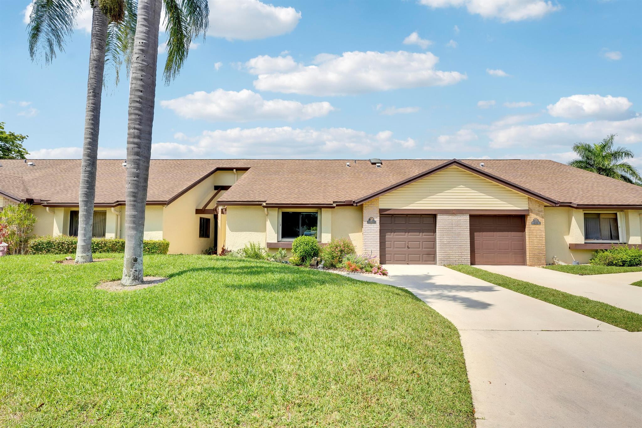 Impeccably updated residence in the desirable 55+ community of Village Walk. This move-in ready home offers beautiful water view and features a brand-new kitchen, fully renovated primary bathroom, new flooring, fresh interior paint, and hurricane impact windows throughout. Additional upgrades include a new garage door, new water heater, new washer and dryer, new garbage disposal, and a new outdoor patio, perfect for entertaining. The HOA provides exceptional value, covering exterior homeowner's insurance (including the roof), cable TV, heated community pool, and landscaping. Buyer must be 55 years or older; however, residents over 18 are permitted to live in the home with the buyer. A rare opportunity to own a fully upgraded home in a prime location