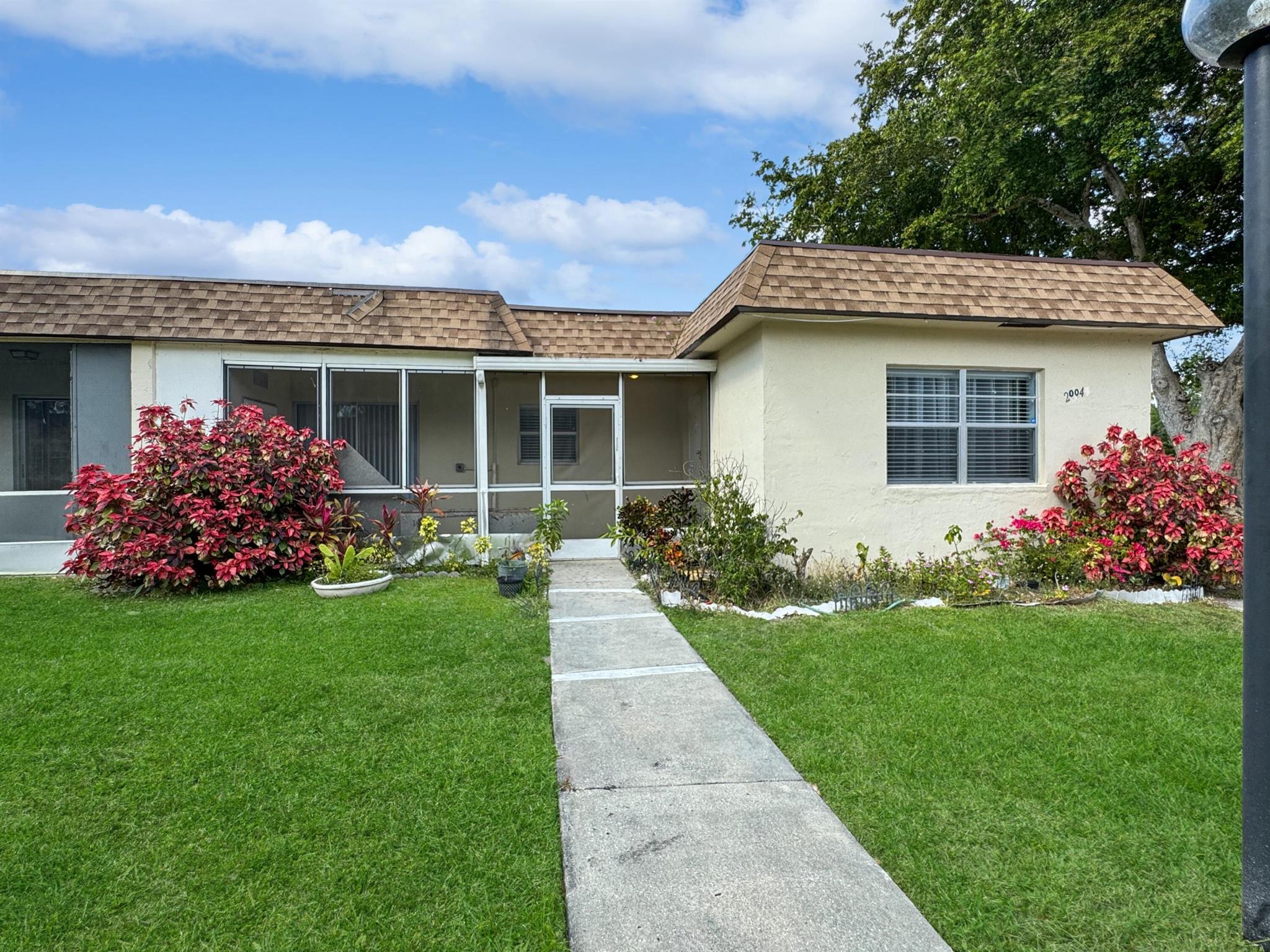 Welcome to this charming 2-bedroom, 2-bathroom villa located in peaceful 55+ community of Natura in Deerfield Beach. This well-maintained unit features a spacious living area, updated kitchen, and a screened porch, perfect for enjoying the Florida breeze and a NEWER ROOF!. The community offers fantastic amenities, including a pool, clubhouse, and more. With easy access to I-95, shopping, dining, and beautiful beaches are just minutes away. Enjoy the convenience and comfort of living in this vibrant, age-restricted community. Don't miss this opportunity to call it home!