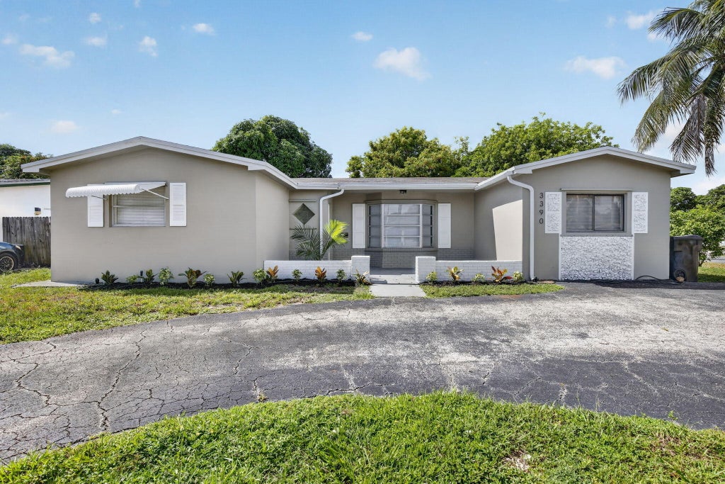 Photo of 3390 NW 42nd Street, Lauderdale Lakes, FL 33309 (MLS # B26071144)
