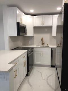 Beautifully renovated for the person who expects more! Wall to wall large porcelain tile, shaker cabinetry, quartz counters, stainless appliances, custom closets and both bathrooms renovated stylish and sexy! Light and bright corner unit on the ground floor with parking that is right out front! Excellent consciences landlords who aim to please! Water, cable and wi-fi included in rent. Washroom is just a few steps away. Century Village has 24 hour manned gates with beautifully kept grounds and outstanding clubhouse with Gym and many fitness classes to choose from. There is huge pool but also many satellite pools throughout the complex They also have off Broadway shows in their Large theater that are very affordable and enjoyable. Come see what all the fuss is about! Available Aug 1 2025