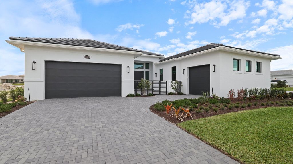 Photo of 8353 SW Puccini Way, Port Saint Lucie, FL 34987 (MLS # B26018437)