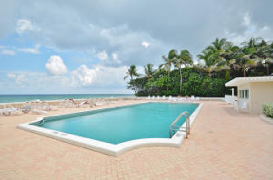 Lovely 2 bedroom/2 bath unit, sunny SE exposure, enjoy the sun and on your balcony and both tropical views and views of the ocean.  New impact sliders.  This unit is on the access floor to the pool and ocean. 24 hr doorman, tennis & garage parking.