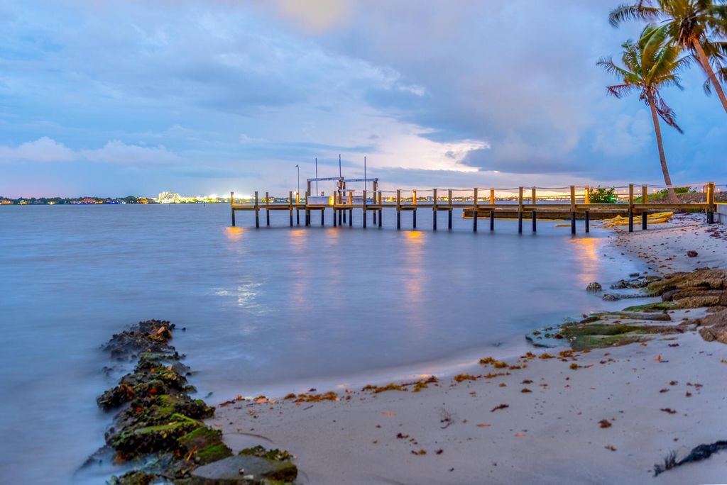 Photo of 1002 NE Glass Drive, Jensen Beach, FL 34957 (MLS # R10904842)