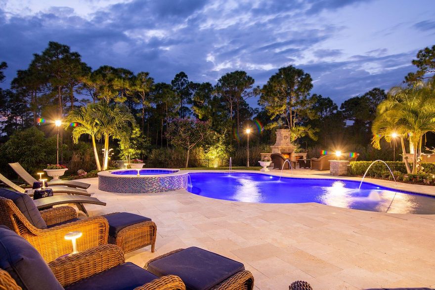 This Gorgeous Prado Home is a Modern Elegant masterpiece. Exquiste Extended Yorkshire Model includes 4 bedrooms, 5 1/2 baths, office, club room & 3 car garage on over a half acre w/ith views of a custom back yard oasis and a peaceful preserve.Magnificent covered courtyard welcomes you to a Stunning double door entry way with exquisite marble lighted square columns. Chef's Island Kitchen overlooking gracious size great room with tray ceilings & lots of crown molding.Kitchen boasts with lots of gorgeous counters, designer backsplash,double ovens & walk-in pantry any gourmet chef would envy. Spectualuar floor to ceiling windows through out the back of home overlooking a backyard pool, Summer kitchen with endless granite counters a stone fireplace,  pizza oven, built in BBQ grill &