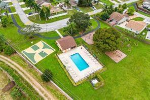 Are you looking for a single-family home in west Boca. This 2-bed, 2-bath, 1-car garage with a large screened patio and fenced yard is ready for you. This home is in Tudor Woods, a small community of affordable patio style homes located in the West Boca corridor, near shopping, dining and top-rated schools. Inside the house has vaulted ceilings, a new kitchen with separate dining area overlooking the front yard. The house is unique in the neighborhood as it one of a few that has a back fence that is accessible for a pool. Community has a pool and sundeck, playground and barbecue area. Low HOA fee with minimal rules. Lots of options for a new owner to add their individual touches to create their own dream home.