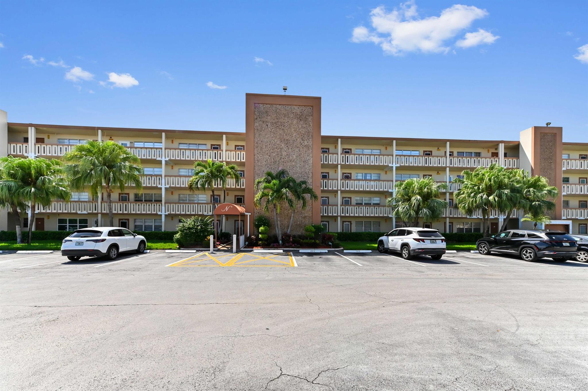 Welcome to this charming main-floor unit in a gated, manned, 55+ community, perfectly nestled in a 4-story waterfront condo overlooking a tranquil lake. This 1-bedroom, 1.5-bath home features all-tile flooring throughout and a functional kitchen equipped with appliances, including a fridge and range. Enjoy serene lake views from your private patio, ideal for relaxing mornings or peaceful evenings.Residents have access to exceptional amenities, including a clubhouse, pool, fitness center, pickleball, tennis, bocce ball, shuffleboard, game room, library, common laundry, elevator access, courtesy bus, street lights, and more.Don't miss out on resort-style living in this vibrant and active community!