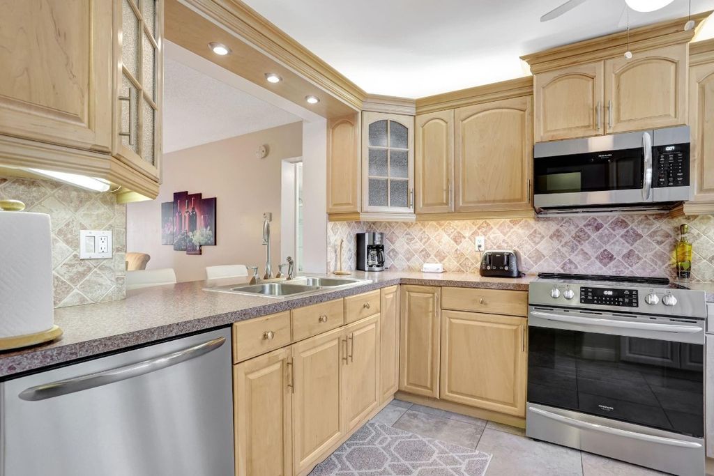 Photo of 4040 Crystal Lake Drive #202, Deerfield Beach, FL 33064 (MLS # F10533241)