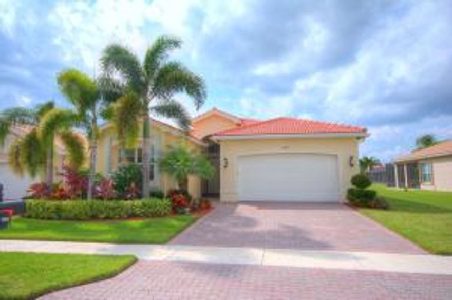 Beautifully landscaped home with a fabulous center long lake view and an extended screened patio. From the moment you enter the screened enclosure into the home you will see all tile on the diagonal (no carpet) crown molding neutral color paint and a beautiful lake view.The kitchen with the wall down so open to the great room, dining room and family room. The windows in the back of the house has window tint so that the house is bright but not hot. There are hurricane shutter on the whole home.The kitchen with 42 inch cabinets with all pull out draws and granite counters with a full granite back splash.Upgraded stainless steel appliances and the house is wired for a generator. Very active clubhouse, cafe',resort-style pools,clubs of all kinds,state of the art fitness.