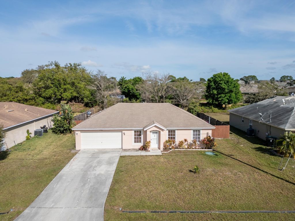 Photo of 3581 SW Kromrey Street, Port Saint Lucie, FL 34953 (MLS # R11069825)