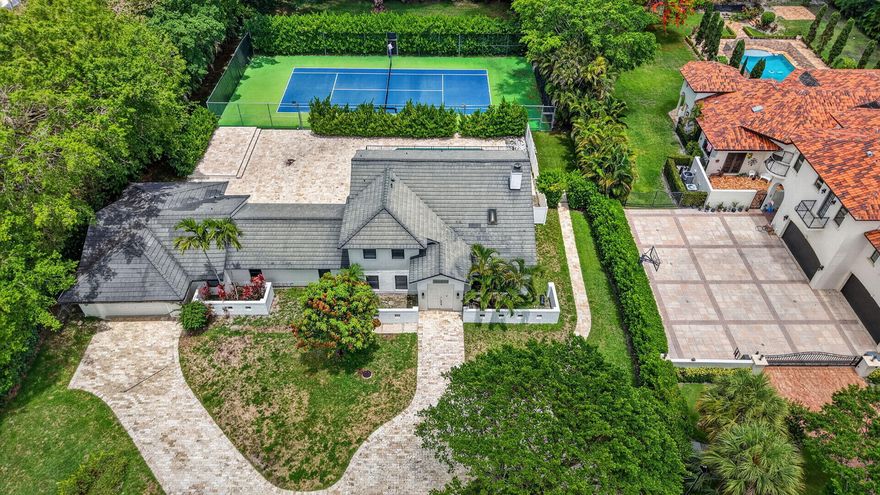 Welcome to 8044 Twin Lake Drive, a spacious 5 bed/ 4 bath home with over 4,100 square feet of living space situated on a generous 1.18 acre lot in prestigious Long Lake Estates. This meticulously refreshed estate features fresh interior paint and roof repairs. The pool has been redone and professionally pressure washed. A private tennis court and elegant marble paver driveway showcase the quality upgrades throughout.   Long Lake Estates is a 24-hour guard-gated community where each home sits on a minimum 1-acre lot among tree-lined streets and sparkling lakes. Centrally located in Boca Raton, minutes from I-95, shopping, dining, top-rated schools, and Atlantic Ocean beaches. This exceptional property offers sophisticated Florida living! Schedule your showing today!