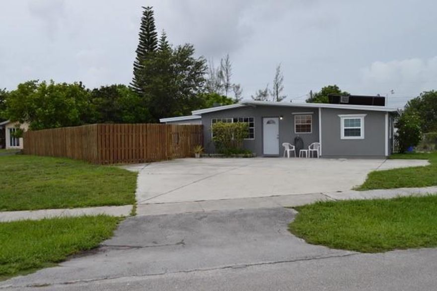 POOL HOME ON A LARGE FENCED CORNER LOT. NEW A/C UPGRADED KITCHEN.