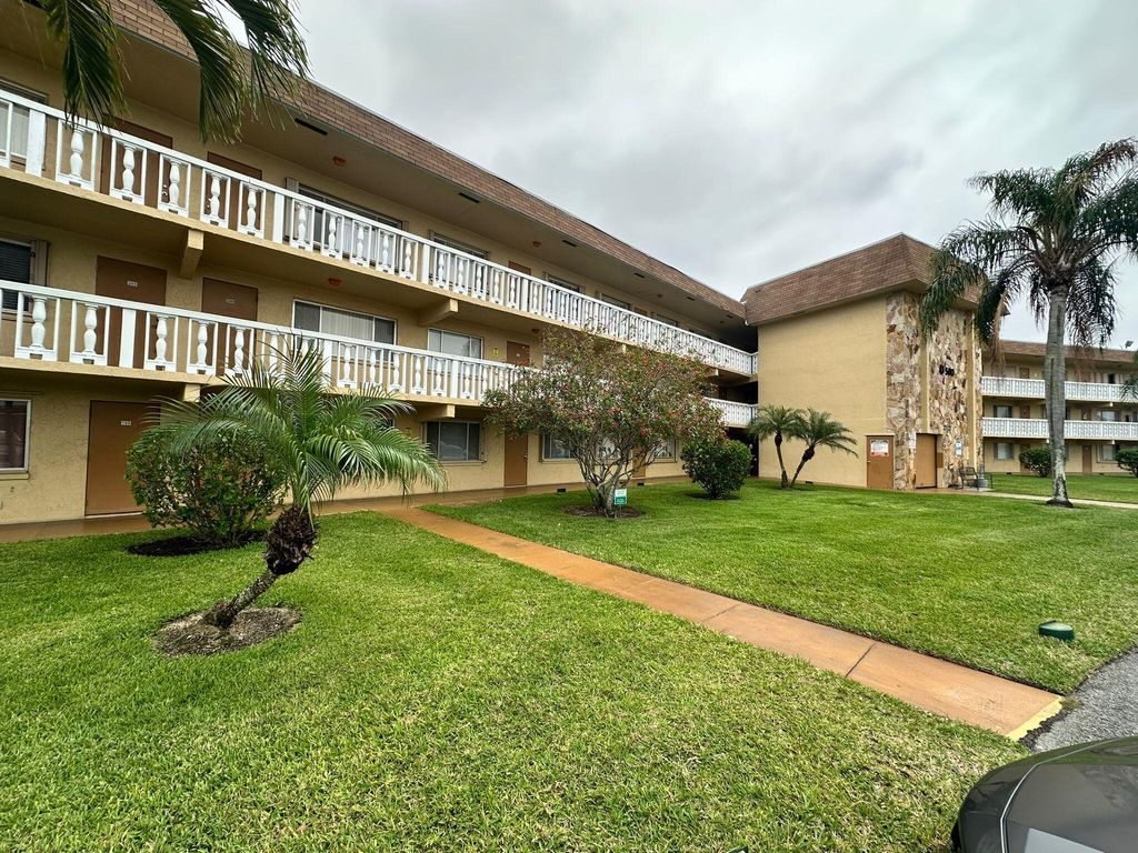 Photo of 500 Village Green Circle W # 205, Palm Springs, FL 33461 (MLS # B26005205)