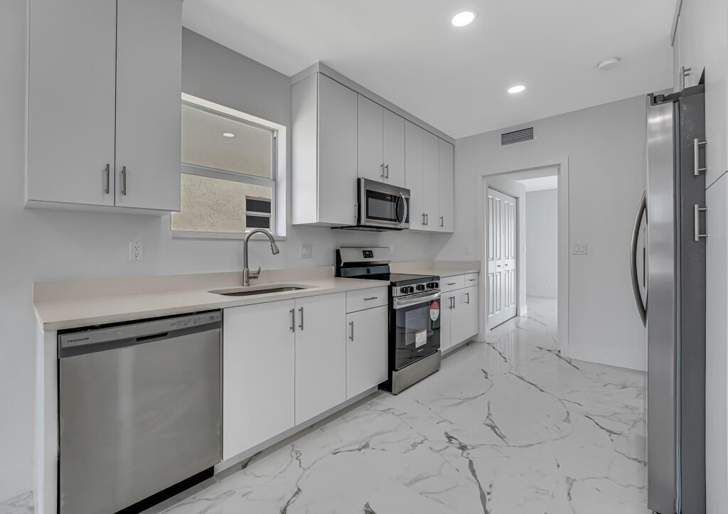 NEW CONSTRUCTION! Beautiful 3 bed, 2.5 bath CBS home with NO HOA and no restrictions. Features impact windows, tile flooring downstairs, and laminate upstairs. Primary bedroom on the first floor with private exterior entrance and inside access. Across from a community park and near a water park. Great location--minutes to beaches, shopping, dining, entertainment, and schools. Perfect for first-time buyers, seasonal residents, or investors. Move-in ready and priced to sell--don't miss this opportunity!