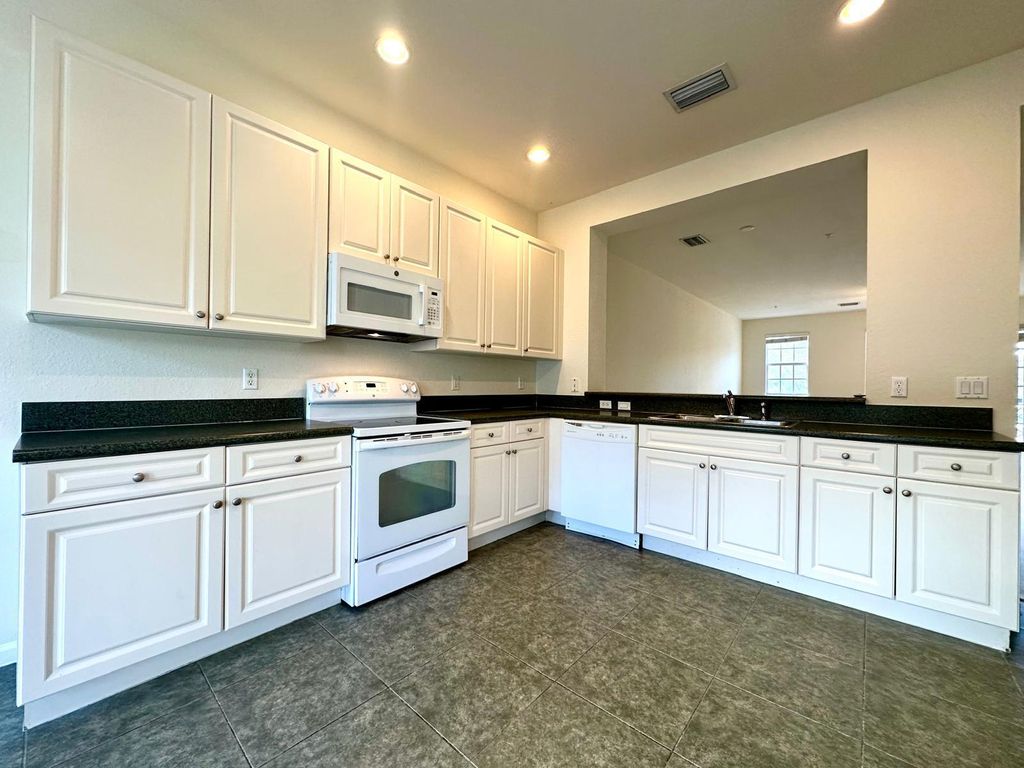 Photo of 425 Greenwich Circle #207, Jupiter, FL 33458 (MLS # R11029516)