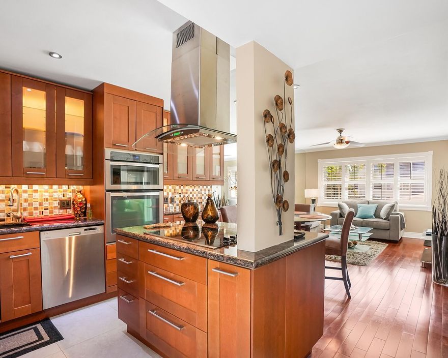 Stunningly remodeled 1-bedroom, 1-bath condo in 55+ Camelot Hall, Lauderhill East. Open-concept kitchen with hood, center island with storage, stainless steel appliances, granite countertops, custom backsplash, and cabinetry. Wood flooring throughout and impact glass. Enjoy a tranquil courtyard view from the enclosed balcony. Renovated bathroom shines, too. AC from 2013 and a tankless water heater. Building roof is just 2 years old. A move-in-ready gem—come see this unit today and make it yours.