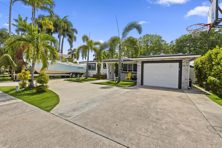 Fully renovated 4BR/3BA home PLUS extra room in the heart of Hollywood! Features all impact windows & doors, brand new 2025 roof, updated electrical & plumbing, and newer A/C. Spacious layout includes tile flooring, modern kitchen with newer appliances. Enjoy outdoor living with a large covered patio and built-in summer kitchen under neath a beautiful pergola. Artificial turf in front & backyard for low maintenance. Ample parking with circular driveway, 1-car garage, rear access, and space for up to 10 cars or a boat. No HOA! Prime location near top schools, shopping, dining, nightlife, I-95, just 4.5 miles to Hollywood Beach and 4 miles to Hard Rock Hotel & Casino, Less than a mile from YMCA. Schedule your showing today!