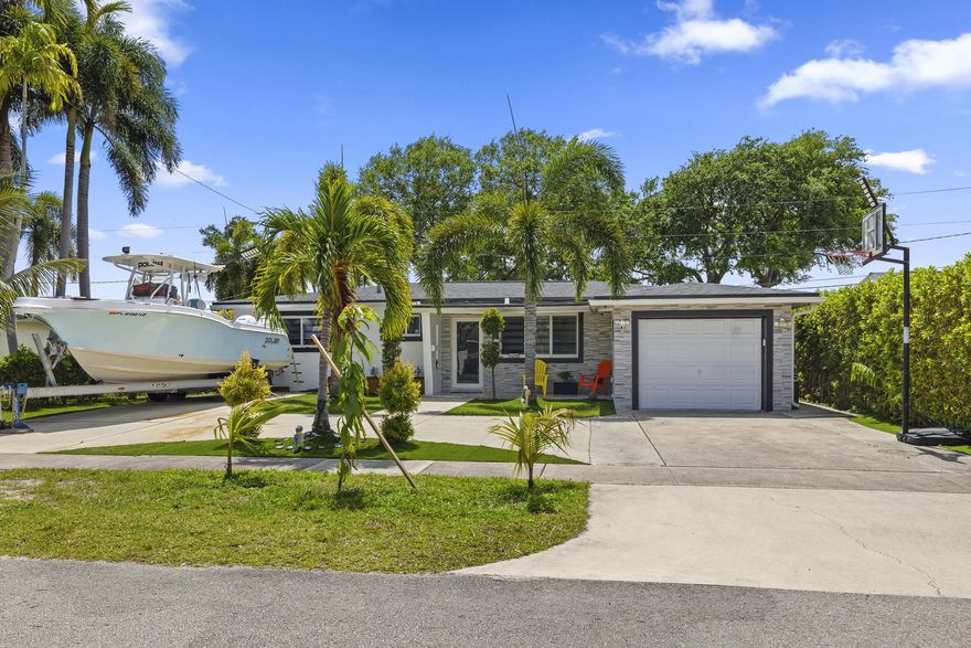 Fully renovated 4BR/3BA home PLUS extra room in the heart of Hollywood! Features all impact windows & doors, brand new 2025 roof, updated electrical & plumbing, and newer A/C, Whole home generator connections installed.Spacious layout includes tile flooring, modern kitchen with newer appliances. Enjoy outdoor living with a large covered patio and built-in summer kitchen under neath a beautiful pergola. Artificial turf in front & backyard for low maintenance. Ample parking with circular driveway, 1-car garage, rear access, and space for up to 10 cars or a boat. No HOA! Prime location near top schools, shopping, dining, nightlife, I-95, 7 Miles to The Fort pickleball,4.5 miles to Hollywood Beach and 4 miles to Hard Rock Hotel & Casino, Less than a mile from YMCA. Schedule your showing today!