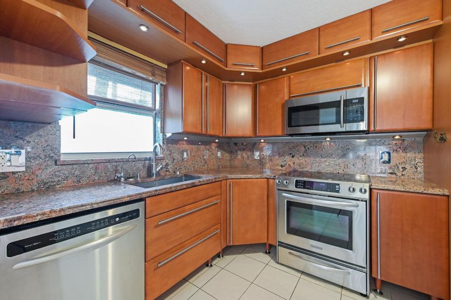 Walk to the beach, shops, restaurants & Eau Palm Beach from this updated condo found in the quaint Intracoastal community, the Barbican. Tucked away in a tropical setting with an inviting community pool & community dock over the Intracoastal. No age restrictions & the lowest condo fees along this coastal area! A must-see light & bright 2 bedroom 2 1/2 bath condo offers a complete renovation that includes exquisite wood cabinetry & granite counter tops in open concept kitchen with stainless steel appliances, along with in-unit laundry with full-size washer & dryer. Other amenities include IMPACT GLASS WINDOWS & DOORS, newer electrical wiring & panel, 2018 A/C and investors, RENT RIGHT AWAY! Your furry friends are welcome here!