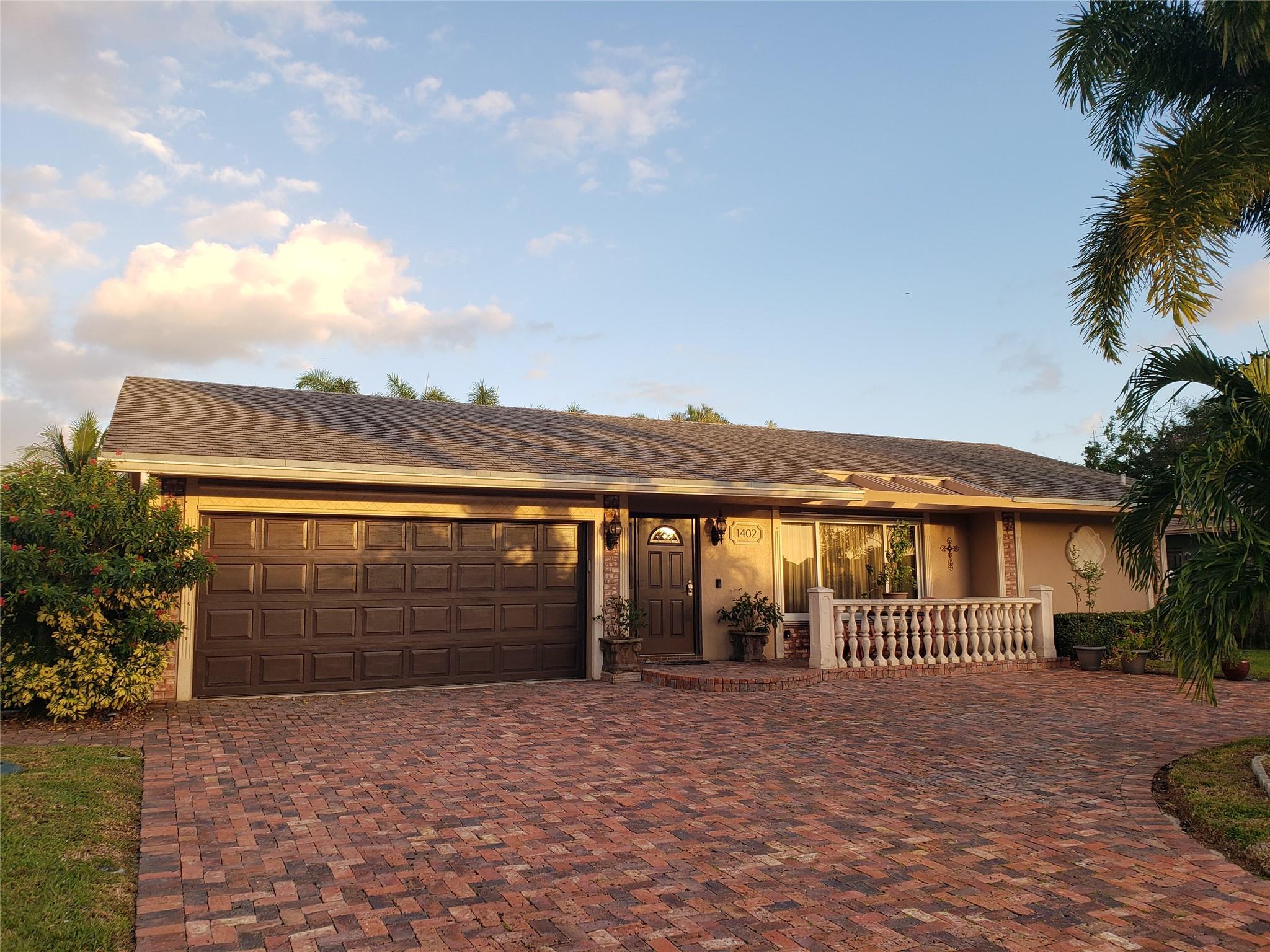 Furnished spacious 3/2 BR home with private pool in a nice neighborhood, 5 miles to the beach.
Beautifully updated kitchen with cherry cabinets, granite countertops & subzero refrigerator.
Volume ceiling in kitchen/dining area and view of pool from living, dining & master bedroom.
Split floor plan, walk in closet in master bedroom, 2 Car garage, Shopping within walking distance.
Enjoy the tropical fenced-in backyard with Waterfall Pool, Spa, Pool bar, BBQ/Smoker and covered outdoor seating.
Lawn & Pool service included in rent.
