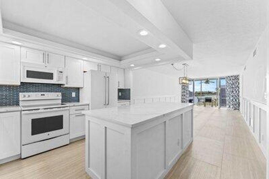 Resort-style living in a vibrant 55+ Intracoastal community! Enjoy a bright, open floor plan with fantastic water views from every window. This inviting condo features beautiful, wood-look porcelain tile throughout the living and dining areas, bedrooms, closets, and bathrooms. The fully renovated kitchen (2020) includes updated cabinets, appliances, and a convenient island--perfect for cooking or entertaining. Your lease includes all Seagate amenities, including: free WiFi and cable; updated clubhouse with game room, kitchen, and library; two pools; BBQ/picnic area; shuffleboard, bocce ball, and a putting green. Prime location close to shopping, dining, and gorgeous ocean beaches!