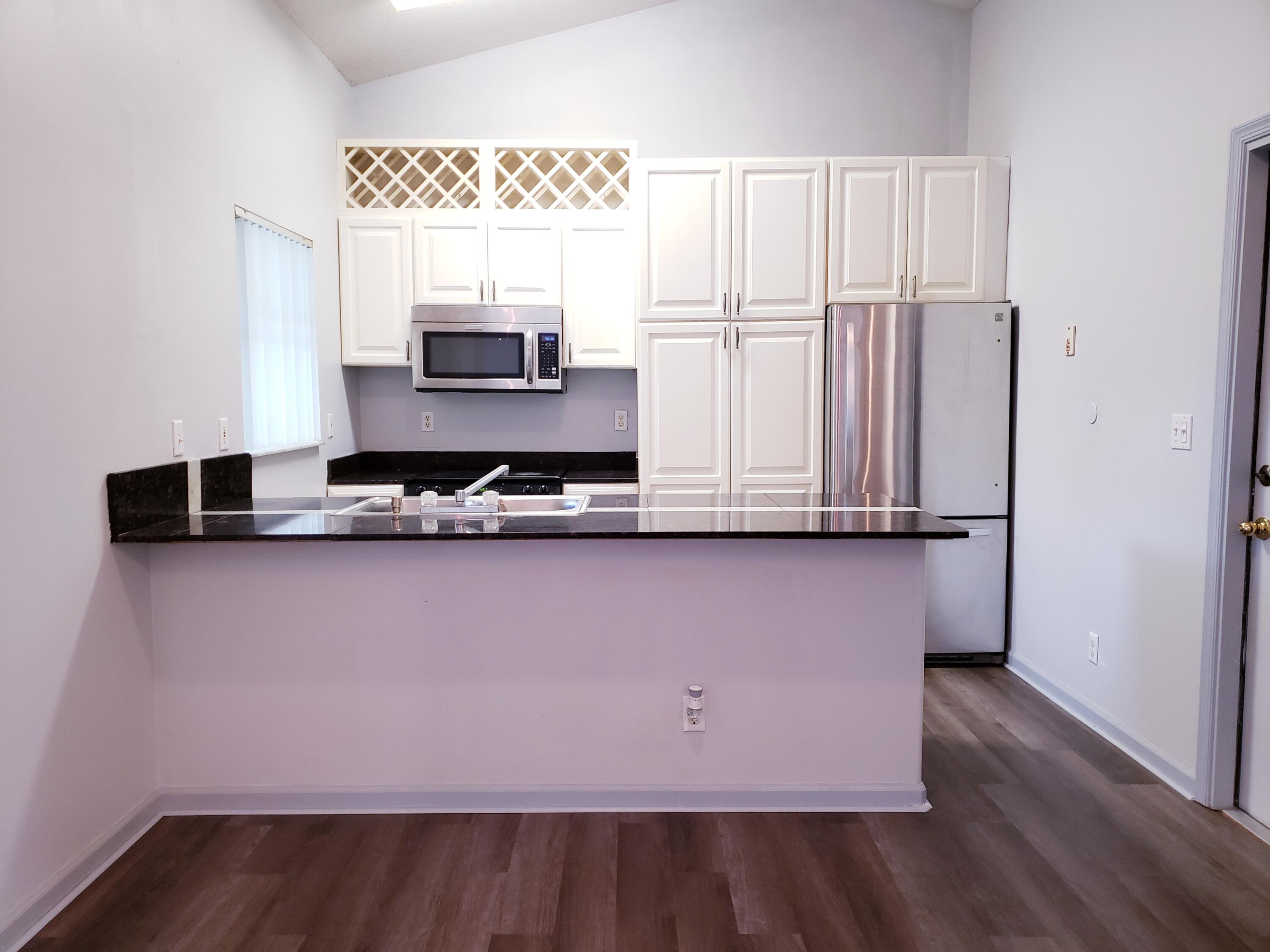 New vinyl waterproof floors throughout the home with newer appliances. Huge yard with a pond in the backyard. The kitchen overlooks the family room with cathedral ceiling. The interior was painted. Close to schools and fire station.