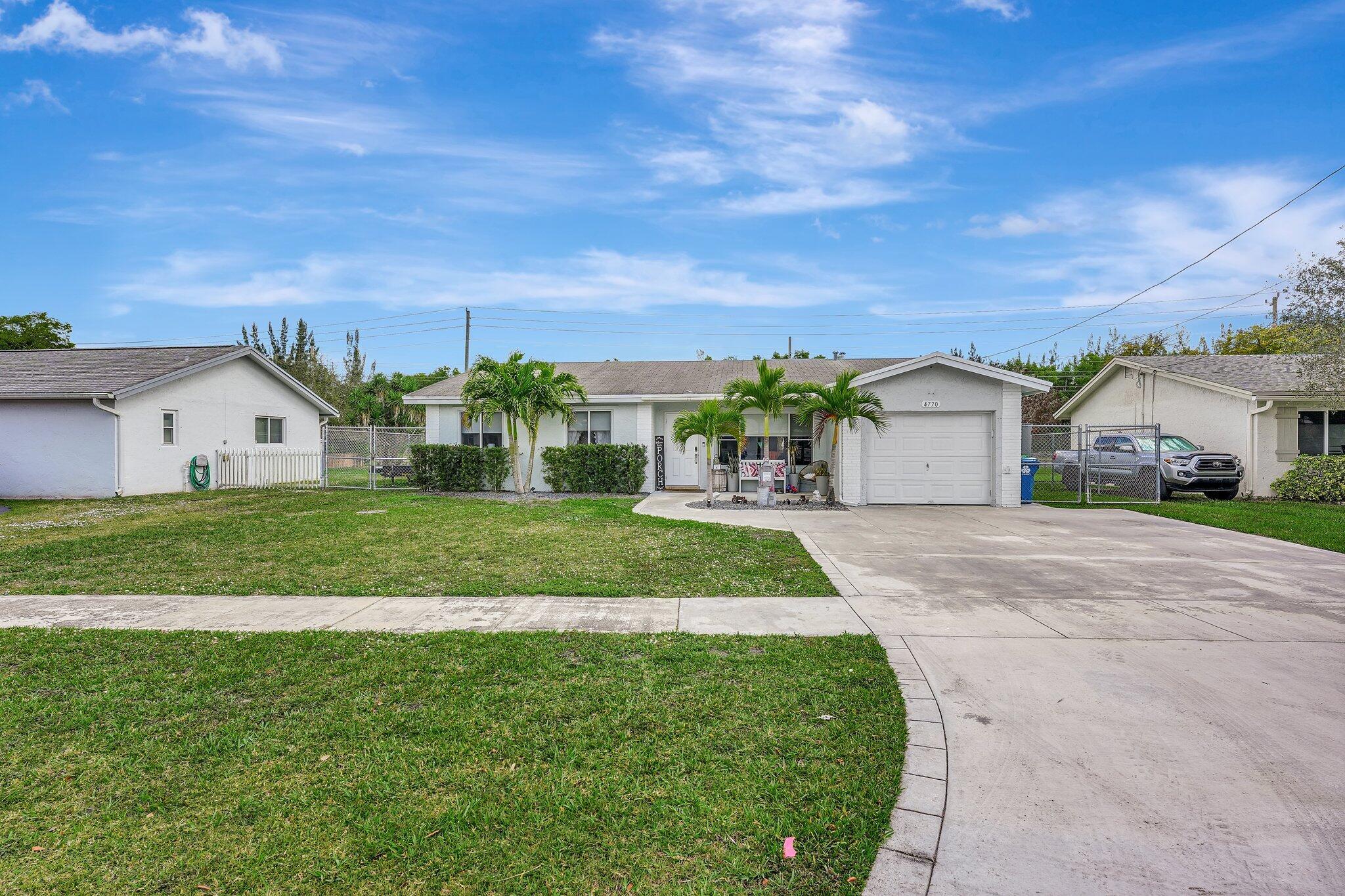 This charming 3 bedroom, 2 bathroom offers the perfect blend of comfort and style. The living area features vaulted ceilings and plenty of natural light, creating a warm and inviting atmosphere. Luxury vinyl plank flooring and modern ceiling fans throughout the home. Stainless steel appliances and granite countertops in the kitchen that overlooks the oversized back yard and pool area. The Florida room has its own AC unit, ceiling fans and has a roof that was replaced in 2023. This home is equipped with natural gas that supplies the range, dryer, water heater and central heat. The large, fenced in backyard has an inground saltwater pool with pavers plus an additional patio, making this the perfect yard for entertaining. The canal behind the home leads to the Markam Park boat ramp.