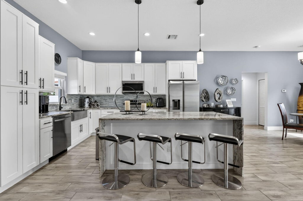 Photo of 3910 SW Laffite Street, Port Saint Lucie, FL 34953 (MLS # B26036586)