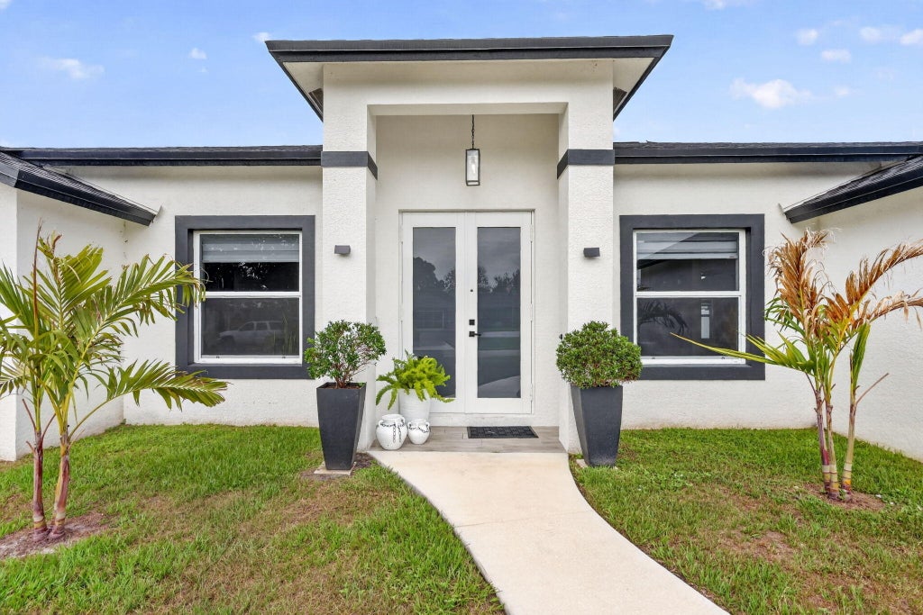 Photo of 3910 SW Laffite Street, Port Saint Lucie, FL 34953 (MLS # B26036586)
