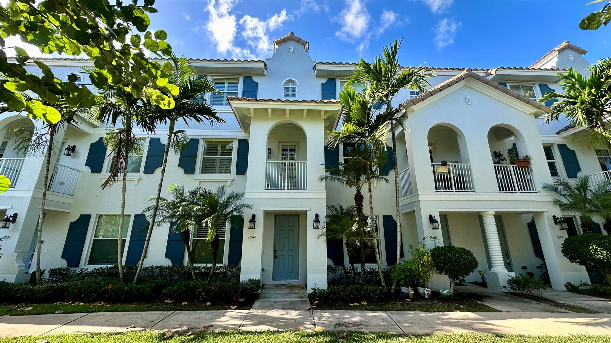 This townhouse in South Florida features 4 BEDROOMS PLUS OFFICE and three and a half bathrooms. The layout includes one bedroom on the first floor and three bedrooms on the third floor, offering privacy and separation. The second story boasts a spacious living room, a studio or office for additional space, and a dining room for entertaining guests. Recently painted, the townhouse presents a fresh and updated look. Additionally, it offers the convenience of a two-car garage, providing ample parking and storage space.