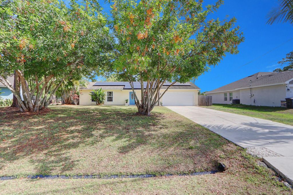 Photo of 1573 SW Wepaco Avenue, Port Saint Lucie, FL 34953 (MLS # R10990079)