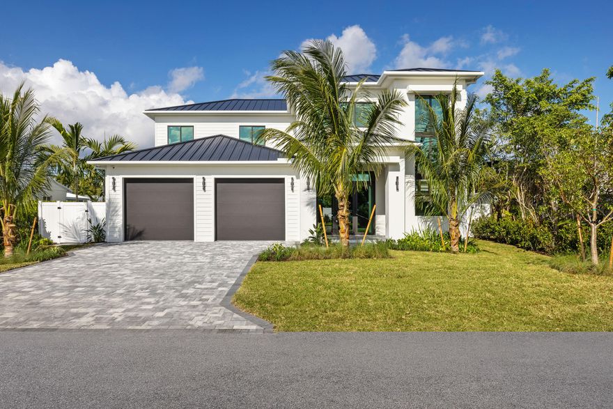 This new 5-bedroom, 4.5-bath home is located in Delray Beach's Lake Ida neighborhood, one of the area's most desirable residential pockets. The layout includes two primary suites, with one on the first floor—well suited for guests, multigenerational living, or a home office—and a second primary suite upstairs.

The main level is open and bright, centered around a kitchen with Thermador appliances, custom cabinetry, a waterfall island, and a hidden pantry. Living and dining spaces connect naturally for everyday use and entertaining. Throughout the home, finishes were selected with attention to detail, including custom stone bathroom vanities, wood-wrapped doorways, fully built-out custom closets, and a combination of wood and porcelain flooring. Upstairs, the primary suite features dual walk-in closets, a bathroom with soaking tub, and access to a private balcony. The first-floor primary suite offers privacy and convenience, creating flexibility in how the home can be used.

Outdoor features include a pool, jacuzzi, outdoor shower, and covered patio, providing a private and functional outdoor space. Additional features include a powder room, 2-car garage, whole-house generator, and a one-year full home warranty from a hands-on builder.

This property is one of the best-priced new construction homes in Lake Ida and is priced to sell, offering strong value compared to other recent builds. The location is just minutes from Atlantic Avenue, the beach, dining, and shopping.