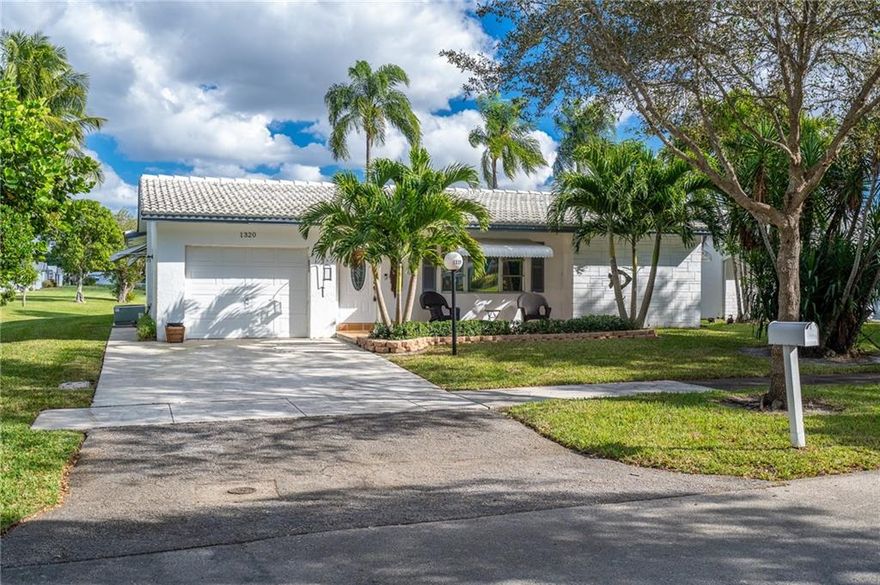Lakefront, rarely available 2/2 w/garage single family "Lakeview" model; million-dollar wide water view from the moment you enter the home; impressive, open plan kitchen. Remodeled and re-thought floorplan makes this unique property a must see. Pool, tennis, and gym across the street for your enjoyment. Very active 55+ community with huge club house, pools, spa's, billiards, ping pong, free bus service at your door, professional shows and more. Low maintenance includes roof repair and replacement, Hi speed internet/Cable TV and much more. Must be seen.