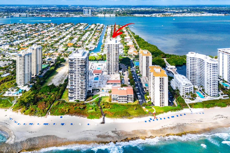Experience refined coastal living in this beautifully appointed residence at 4100 North Ocean Drive, ideally positioned on the coveted shores of Singer Island. This expansive condominium offers a seamless blend of comfort, elegance, and breathtaking scenery, with sweeping views of the Intracoastal Waterway and glimpses of the Atlantic Ocean from multiple vantage points.  Step inside to discover a light-filled, open-concept layout designed for both relaxation and entertaining. The spacious living and dining areas are framed by floor-to-ceiling glass sliders that lead to an oversized, curved private terrace, perfect for morning coffee, sunset cocktails, or simply enjoying the ocean breeze. The interior showcases timeless finishes, including a well-appointed kitchen with granite countertops, custom cabinetry, and premium stainless steel appliances.  The primary suite serves as a tranquil retreat, complete with private balcony access, generous closet space, and a spa-inspired bath. An additional bedroom is thoughtfully designed for comfort and privacy, making this home ideal for hosting guests or creating a serene work-from-home environment. The residence is equipped with high-impact hurricane-rated windows and sliding glass doors, professionally installed in June 2022, offering enhanced storm protection, improved energy efficiency, noise reduction, and added peace of mind while preserving the home's abundant natural light and stunning coastal views! Residents enjoy access to an array of premier amenities, including a resort-style pool and spa, state-of-the-art fitness center, tennis and pickleball courts, and direct access to pristine beaches. A full-service lobby, clubhouse, and on-site management enhance both convenience and peace of mind, elevating everyday living to a resort-like experience.  Perfectly located on Singer Island, this exceptional property offers the ultimate South Florida lifestyle, where luxury, tranquility, and coastal beauty converge.