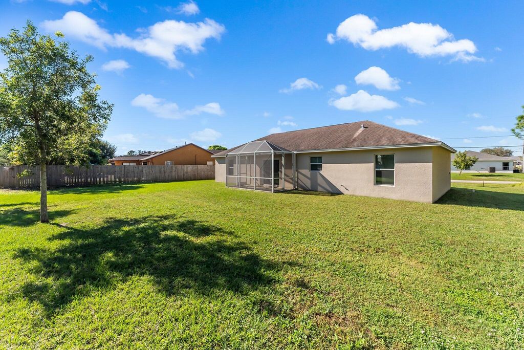 Photo of 2281 SE Monitor Street, Port Saint Lucie, FL 34952 (MLS # R11049660)