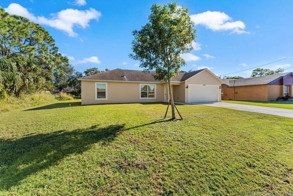 Photo of 2281 SE Monitor Street, Port St Lucie, FL 34952 (MLS # R11049660)