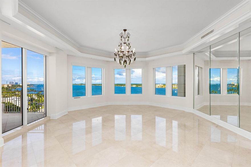 Fantastic Lakefront condominium with over 6,000 total square feet, 4 bedrooms, 3 baths, and 2 powder rooms. Beautiful Intracoastal, Ocean, and Palm Beach views from all primary rooms. Fabulous indoor-outdoor living with four large waterfront covered terraces. Lovely grand salon and dining room are perfect for entertaining. Oversized chef's kitchen with island and butler's pantry leads to morning room and family room. Elevator opens to private vestibule, welcoming foyer, and stunning views. Spacious Primary Suite with terrace, large bath, and four walk-in closets. Each spacious guest suite opens to terraces with water views. Ample storage throughout and separate storage unit. Two garage parking spaces.