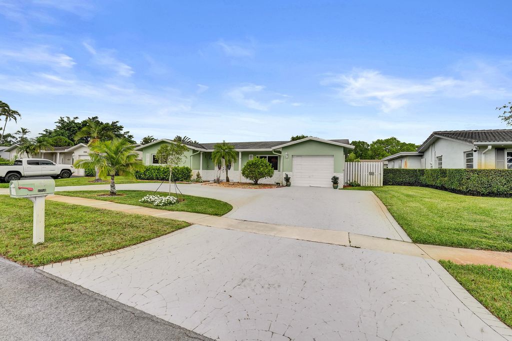 Photo of 1710 NW 111th Terrace, Pembroke Pines, FL 33026 (MLS # B26028849)