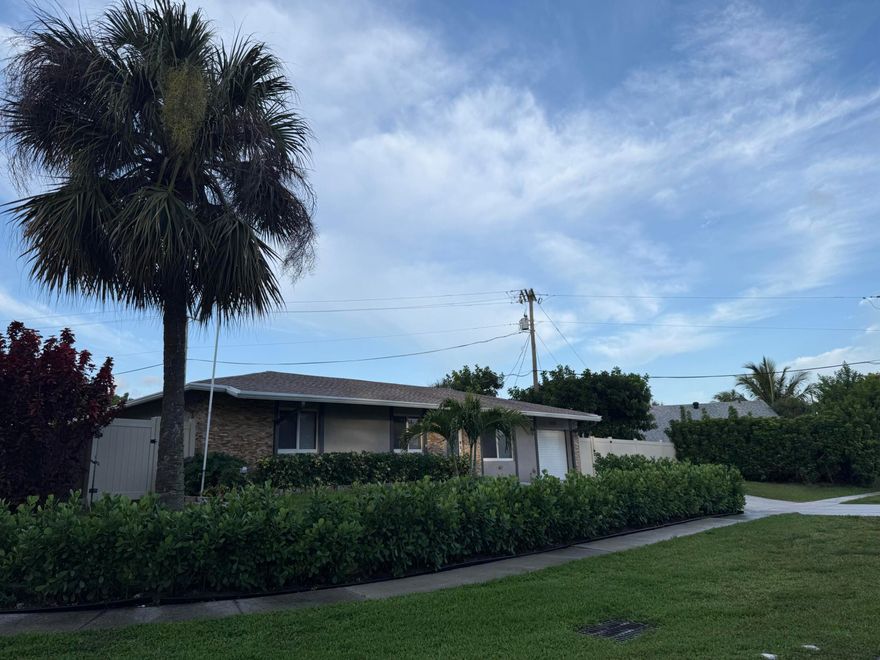 PHOTOS COMING SOON- Fully renovated and loaded with upgrades. 2018 roof, 2023 A/C & gutters, full hurricane impact windows and doors in 2025 - renovation including engineered wood flooring, kitchen cabinets, appliances (refrigerator, oven, microwave, beverage cooler), updated bathrooms (tile, toilets, sinks, cabinetry, shower doors, hardware), interior doors, baseboards, paint, ceiling fans, and washer/dryer. Enjoy a 2021 screened patio, 2020 retractable awning, 2018 vinyl fence, 2025 water filtration system, plus 2026 landscaping and sprinkler system. Turnkey, low-maintenance, nothing left to do—act fast! You will not find another turnkey like this one anywhere. Make the call, it will be the best call that you have ever made. Bring your golf cart, garage for your cart.