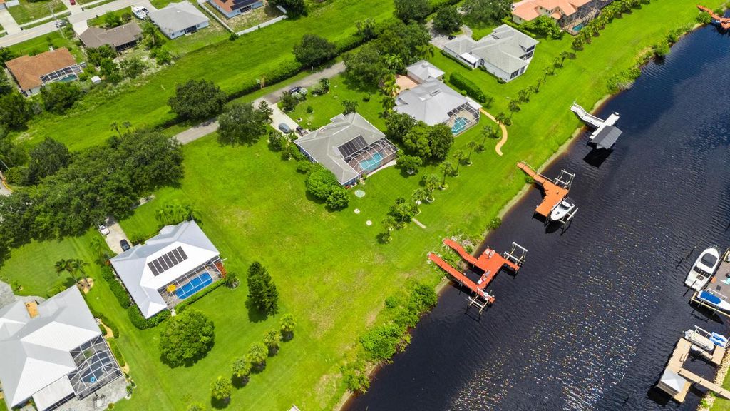 Photo of 2606 SW River Shore Drive, Port Saint Lucie, FL 34984 (MLS # R11010088)