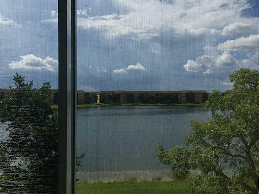 Amazing lake view condo at desirable Century Village of Pembroke Pines. This is a 2/2 , with washer and dryer. New A/C. Tile in the bathrooms and Kitchen. Carpet in living room and bedrooms. Balcony is protected with shutters. This is a great unit for inv estors, can be rent it right away.  55 plus community . No pets aloud. Association includes water and basic cable. Transportation is available , club house, pools, tennis courts, pharmacy, restaurants, and many other  amenities!