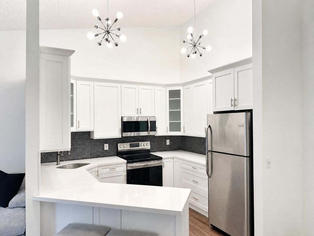 Photo of 6520 Chasewood Drive #Apt G, Jupiter, FL 33458 (MLS # B26028890)
