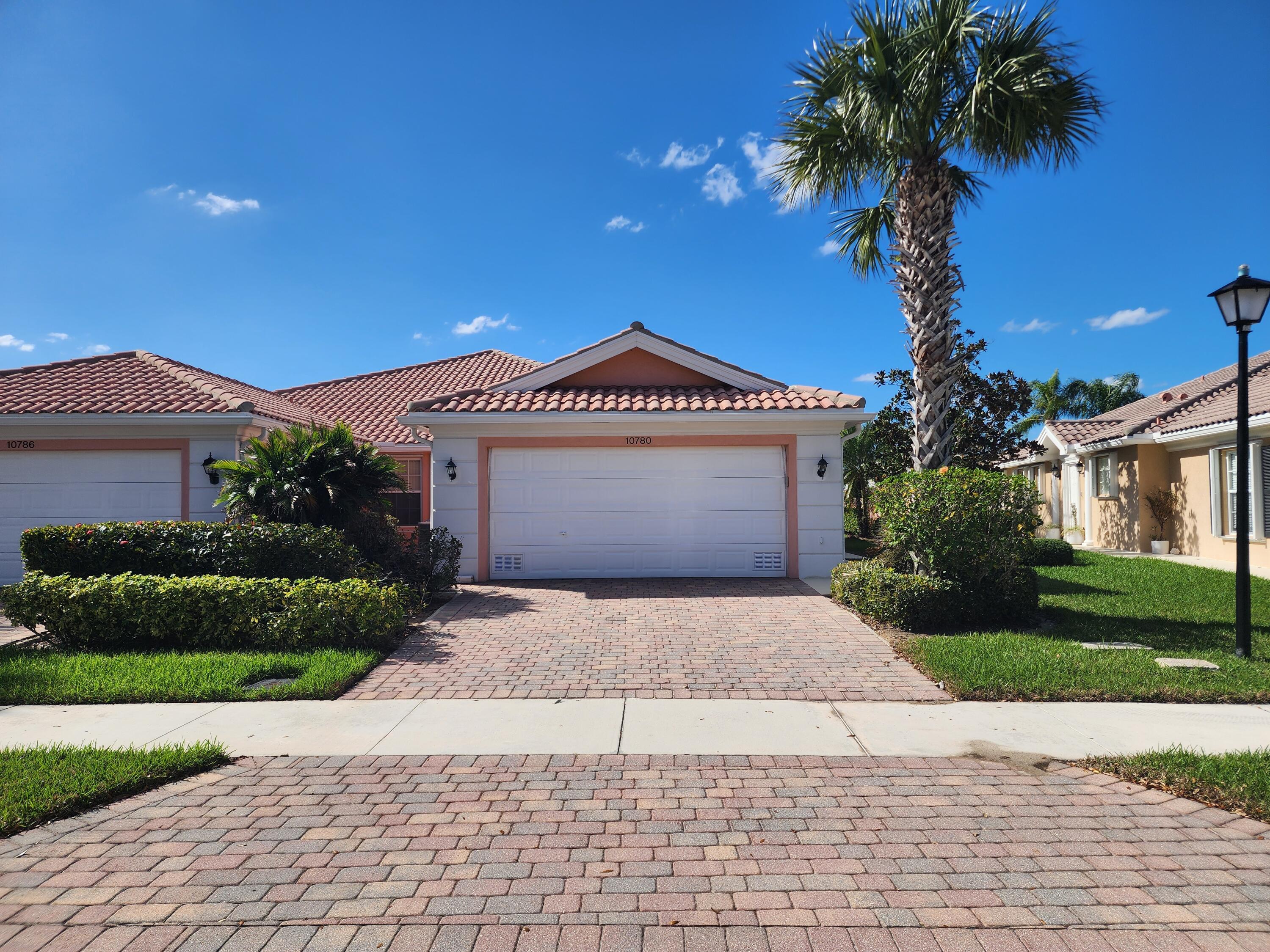 Capri III Villa built by Divosta is located in the master planned community of the ''Lakes at Tradition''. 2 bedrooms / 2 bathrooms with a 2 Car Garage. This unit has an open floor plan for entertaining. Laminate and Tile Floors in the Living Areas. The Villa has a huge oversized screened patio overlooking the preserve. Kitchen has newer appliances. Accordion Shutters for hurricane protection. The clubhouse offers resort style amenities and entertainment for the residents. This home is within walking distance to downtown Tradition. Come and enjoy the shops and restaurants and make the ''Lakes at Tradition'' your new home. HOA fees include basic cable, high speed internet, security alarm , land telephone, all lawn maintenance, exterior painting and 24 hour security.