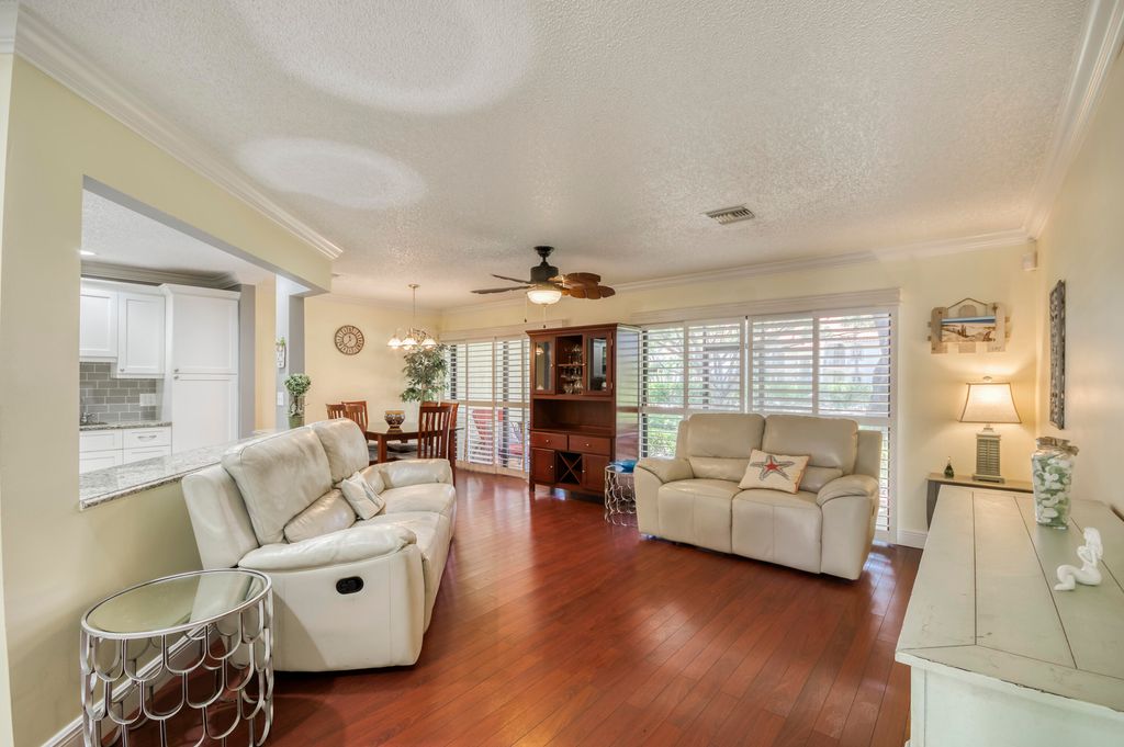 Photo of 10 Lexington Lane E #B, Palm Beach Gardens, FL 33418 (MLS # R11112368)