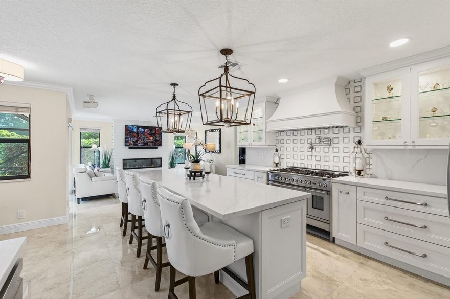 Welcome to this Exquisite, Designer-Appointed Boca Raton Home. This is not just a house; it's a luxurious sanctuary, meticulously cared for by its original owners and nestled within a coveted ''hidden gem'' community of Estates Of Boca Lyons. This 4-bedroom, 2.5-bath residence offers a rare and perfect balance of timeless traditional elegance and modern designer touches. It's entirely move-in-ready, boasting exceptional privacy, a high-end indoor-outdoor flow, and an undeniable ''wow factor'' that appeals to every buyer.Signature Luxury Features & Meticulous Upgrades: Gourmet Chef's Kitchen: The heart of this home is an exquisite, chef-inspired space featuring modern cabinetry, stunning quartz countertops and backsplash, professional-grade stainless steel appliances, and an