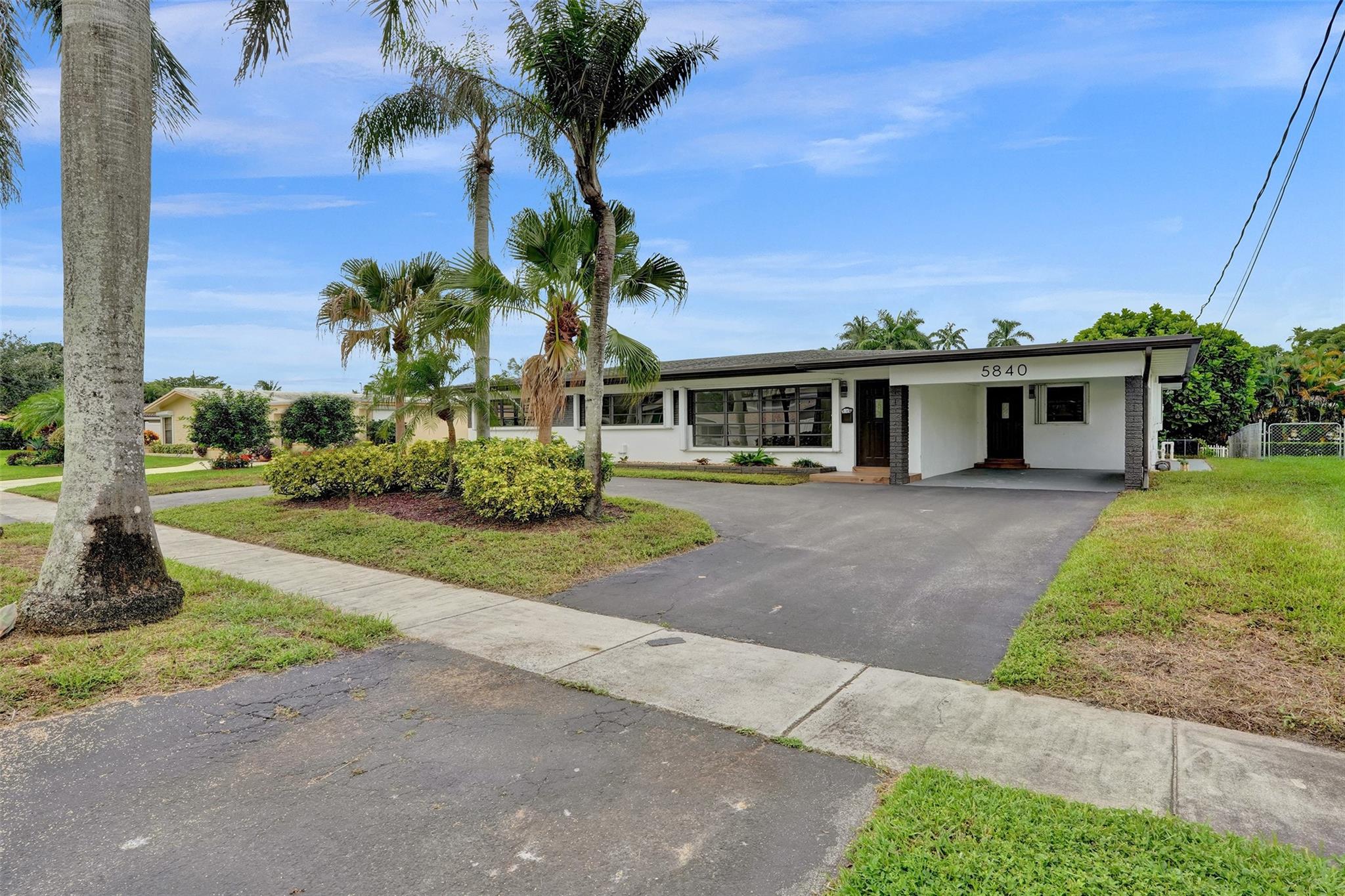SELLER PAYS CLOSING CLOSTS! A 4-bedroom, 2-bathroom waterfront gem in Plantation Isles, this remodeled home is minutes from Fort Lauderdale and provides direct ocean access. The large, open living area with sleek finishes makes it an ideal home for those who appreciate contemporary design and waterfront views. With striking veneer accent walls, a kitchen equipped with stainless steel appliances, and remodeled bathrooms, this home has been fully modernized. The backyard has room for a pool, offering additional outdoor possibilities. Plus, there’s no HOA, making it a great opportunity for comfortable waterfront living.