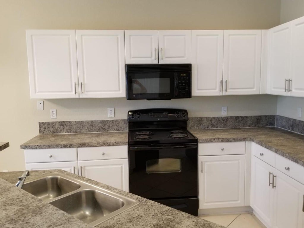 Photo of 984 LUCAYA Drive, Riviera Beach, FL 33404 (MLS # B26093216)